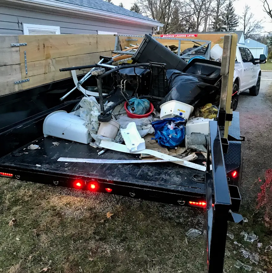 Roll-off dumpster delivered to a residential driveway in Saranac